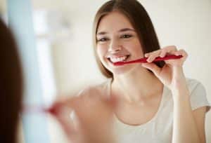 woman brushing Best Dentist Oak Park