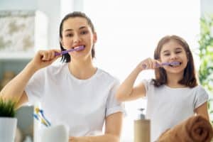 Family Are Brushing Teeth Dentist in Oak Park - One Fine Smile Dentist in Oak Park
