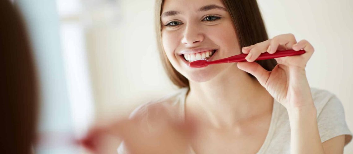 woman brushing Best Dentist Oak Park